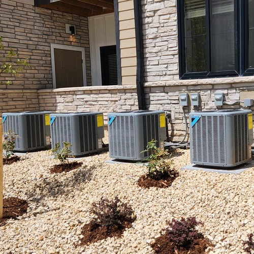 a row of commercial air conditioners