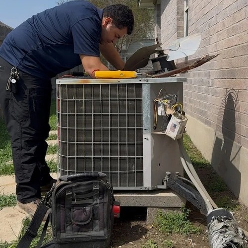 technician installing an air conditioner